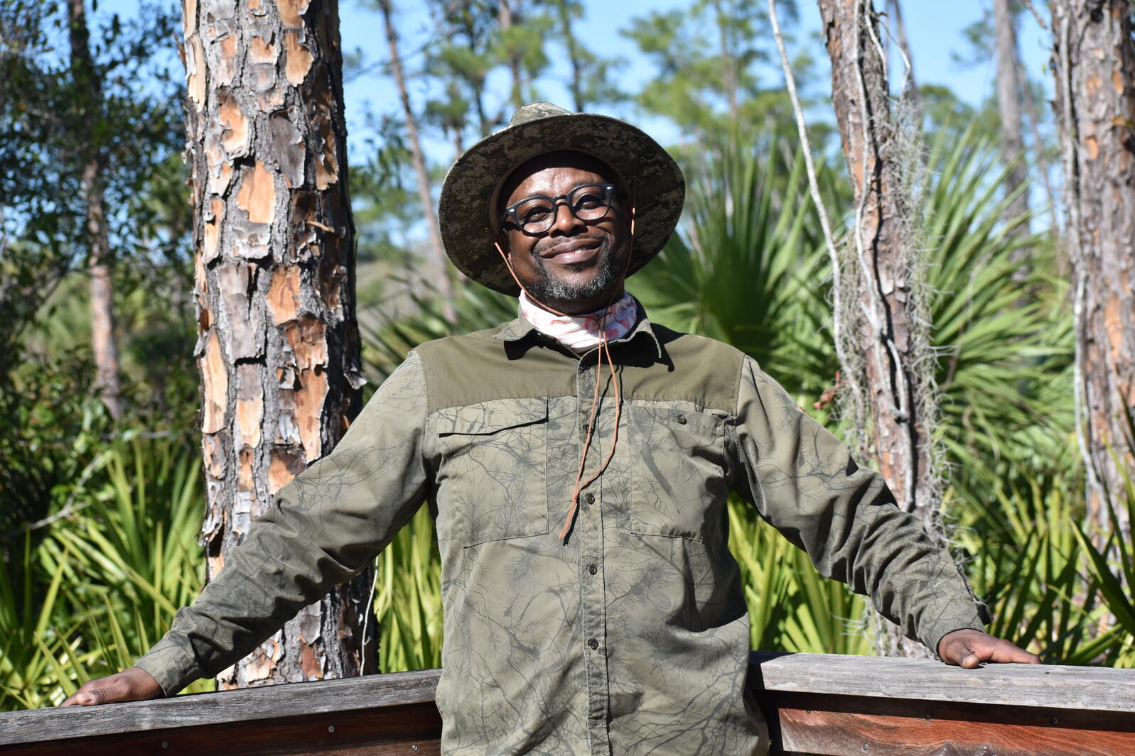 A smiling man in camouflage 