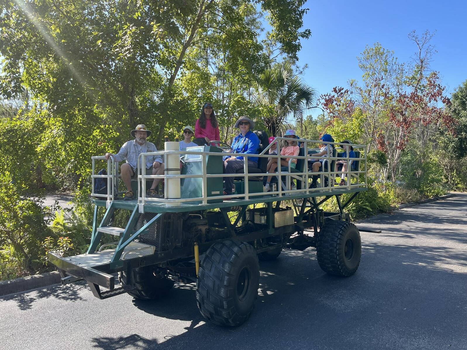 A swamp buggy loaded with campers and counselors.