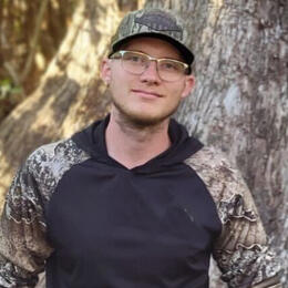 Portrait of a man standing in the woods